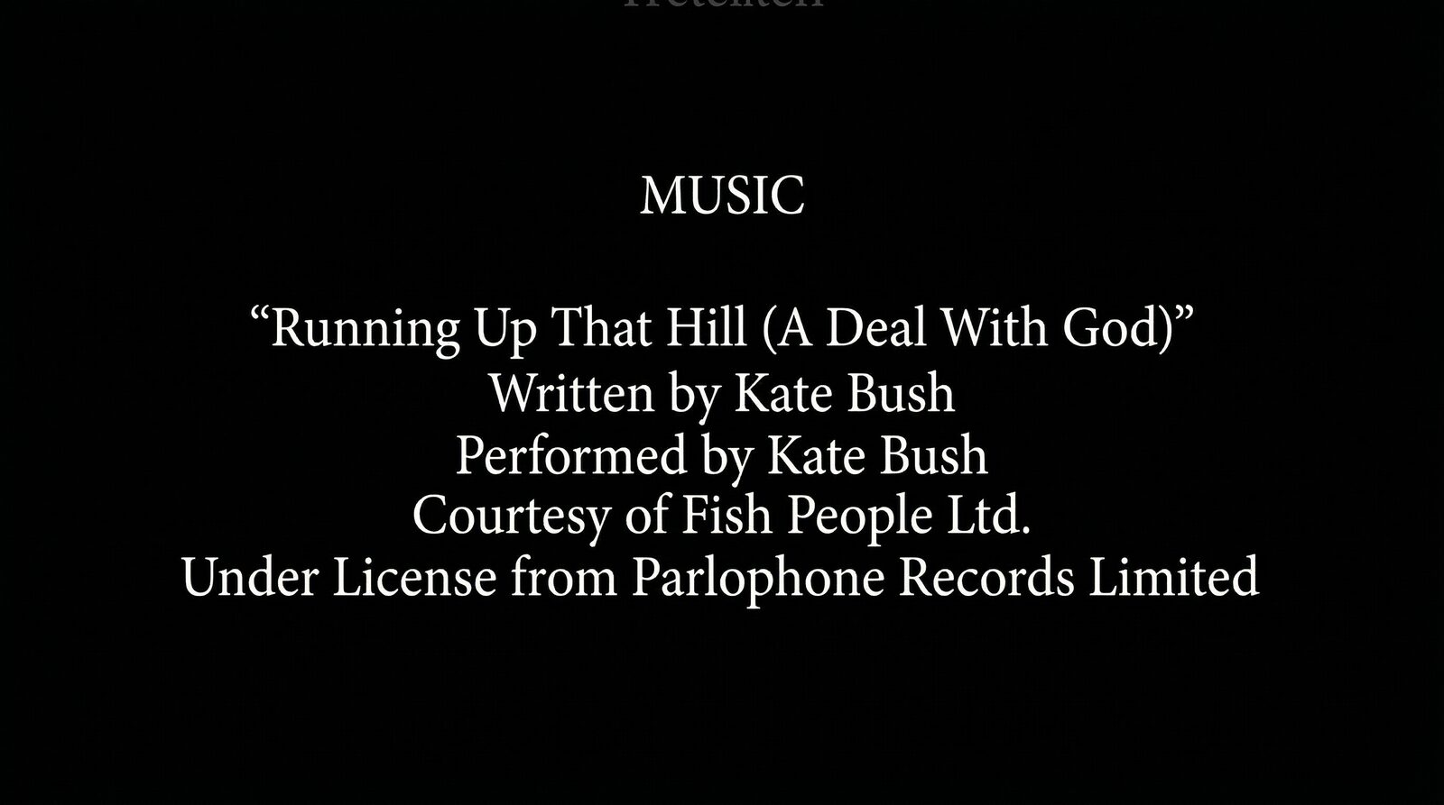 Film end credits scroll showing the licensed song credit block for "Running Up That Hill (A Deal With God)" by Kate Bush — white Trajan-style serif text centered on a black background