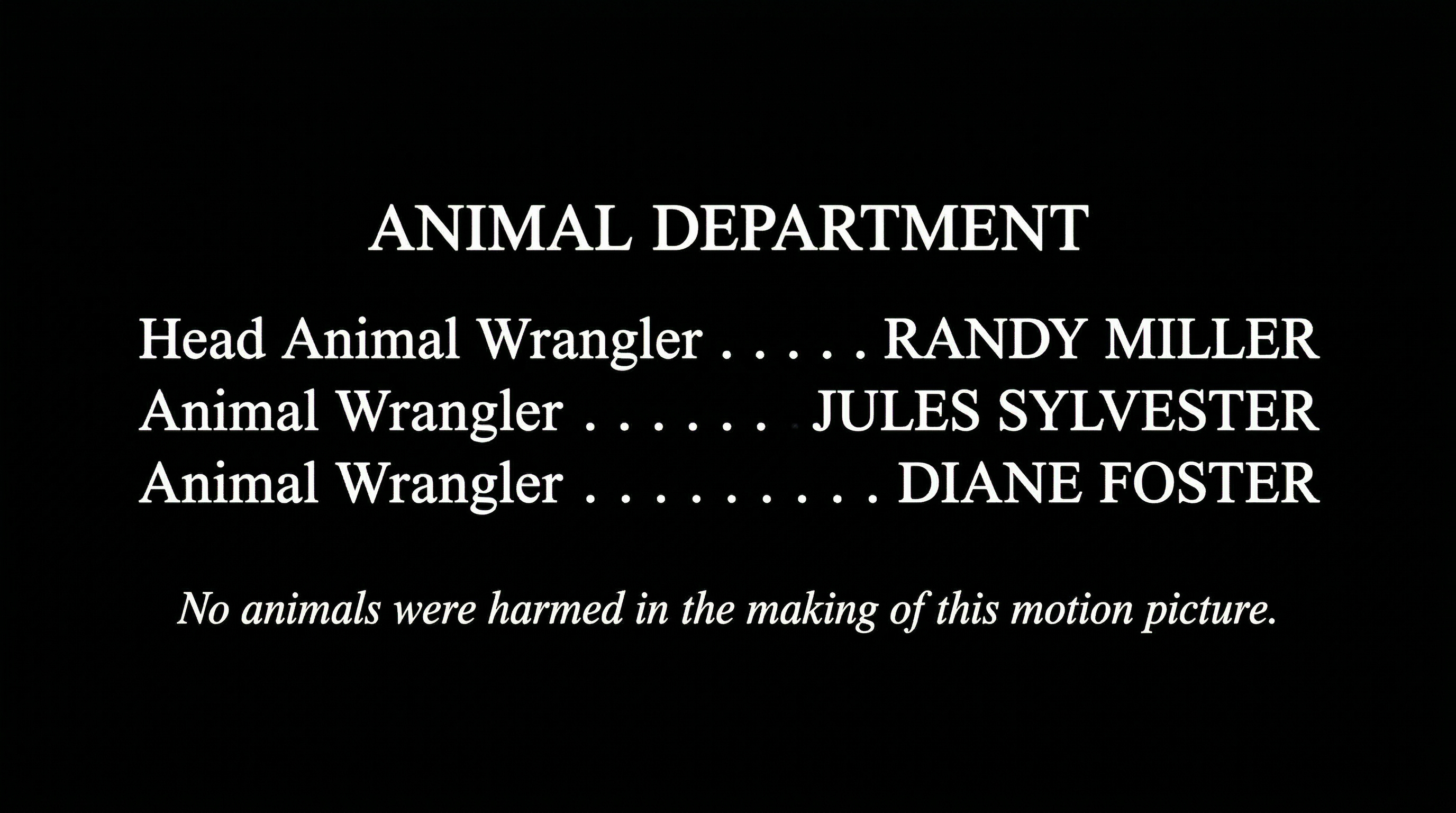 Film end credits showing Animal Department block with Head Animal Wrangler, Animal Wrangler credits, and No Animals Were Harmed disclaimer on black background
