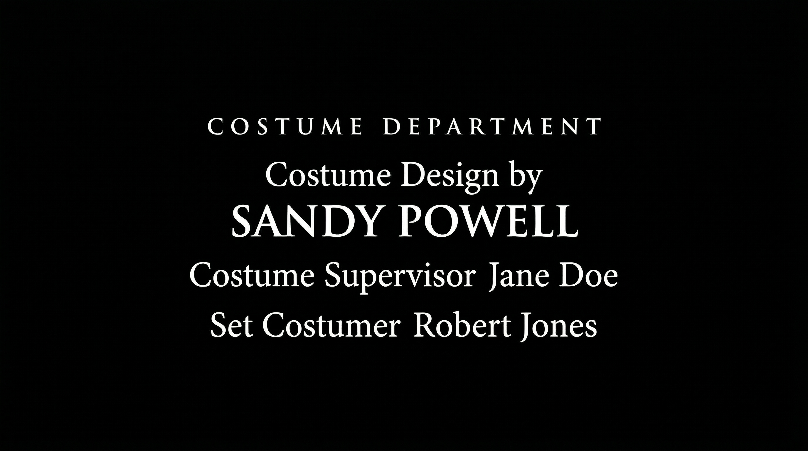 Film end credits showing "COSTUME DEPARTMENT" header with "Costume Design by SANDY POWELL" in cinematic serif font on black background